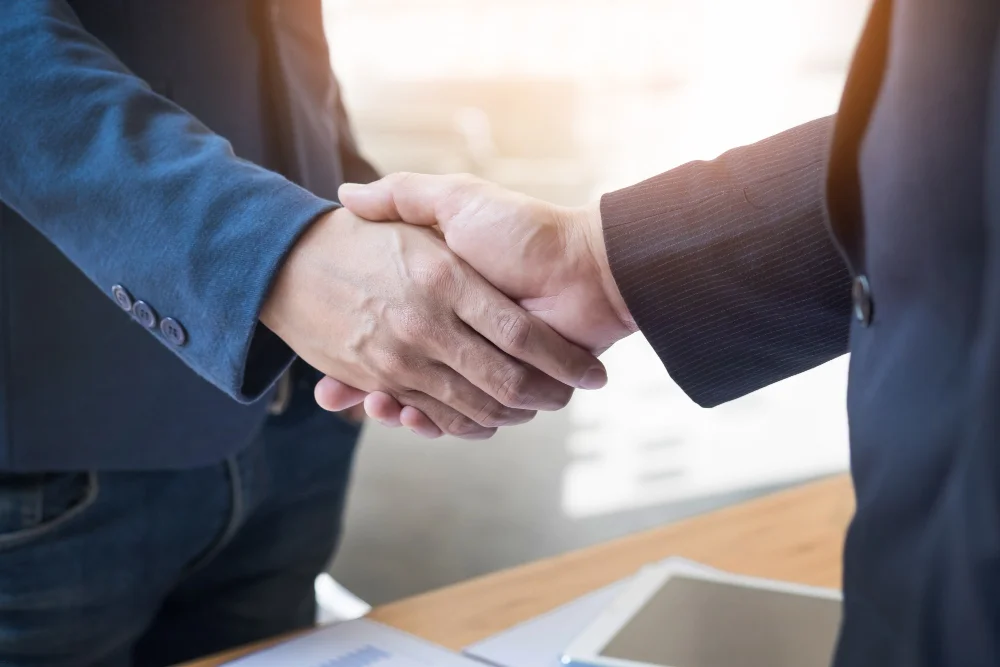 Two businessmen hand shaking